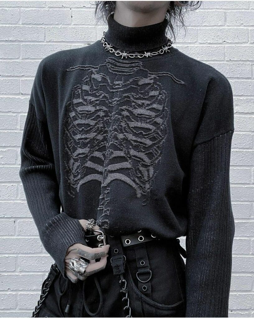 Person wearing a black turtleneck sweater with a grey skeletal ribcage print on the front.